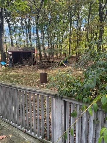a house with a tree in the background