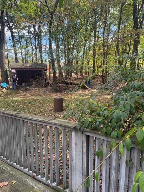 117 Chestnut Ridge Road Acme, PA 15610 - Photo 35 of 36 a view of a backyard with wooden fence and a tree