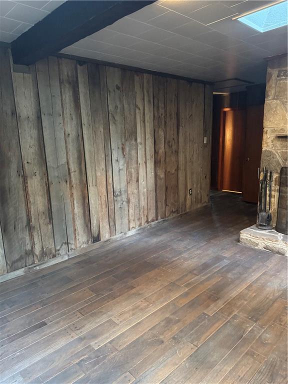 117 Chestnut Ridge Road Acme, PA 15610 - Photo 6 of 36 an empty room with wooden floor and a fireplace