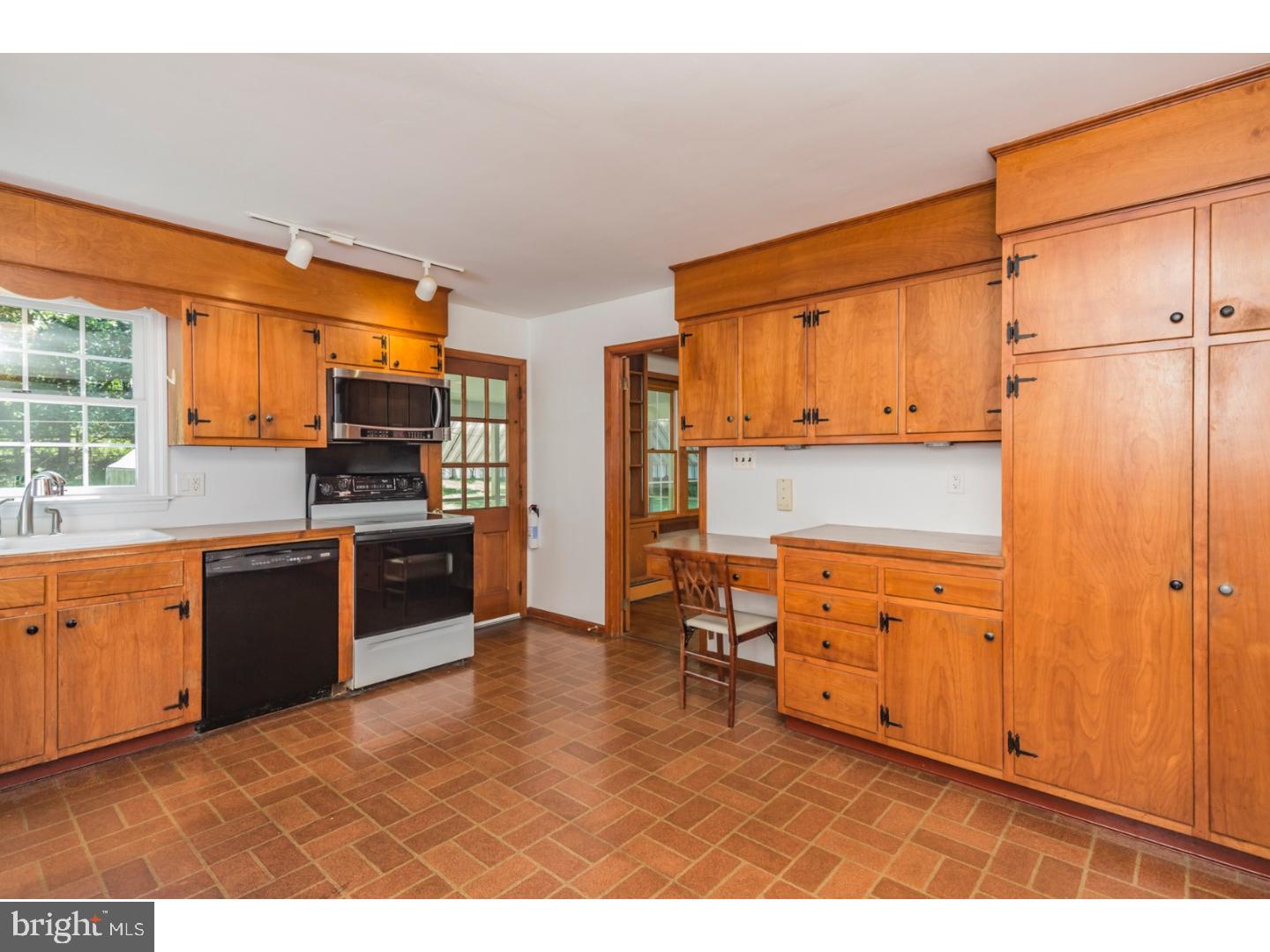 469 Federal City Road Pennington, NJ 08534 - Photo 11 of 25 a kitchen with stainless steel appliances wooden cabinets and a refrigerator
