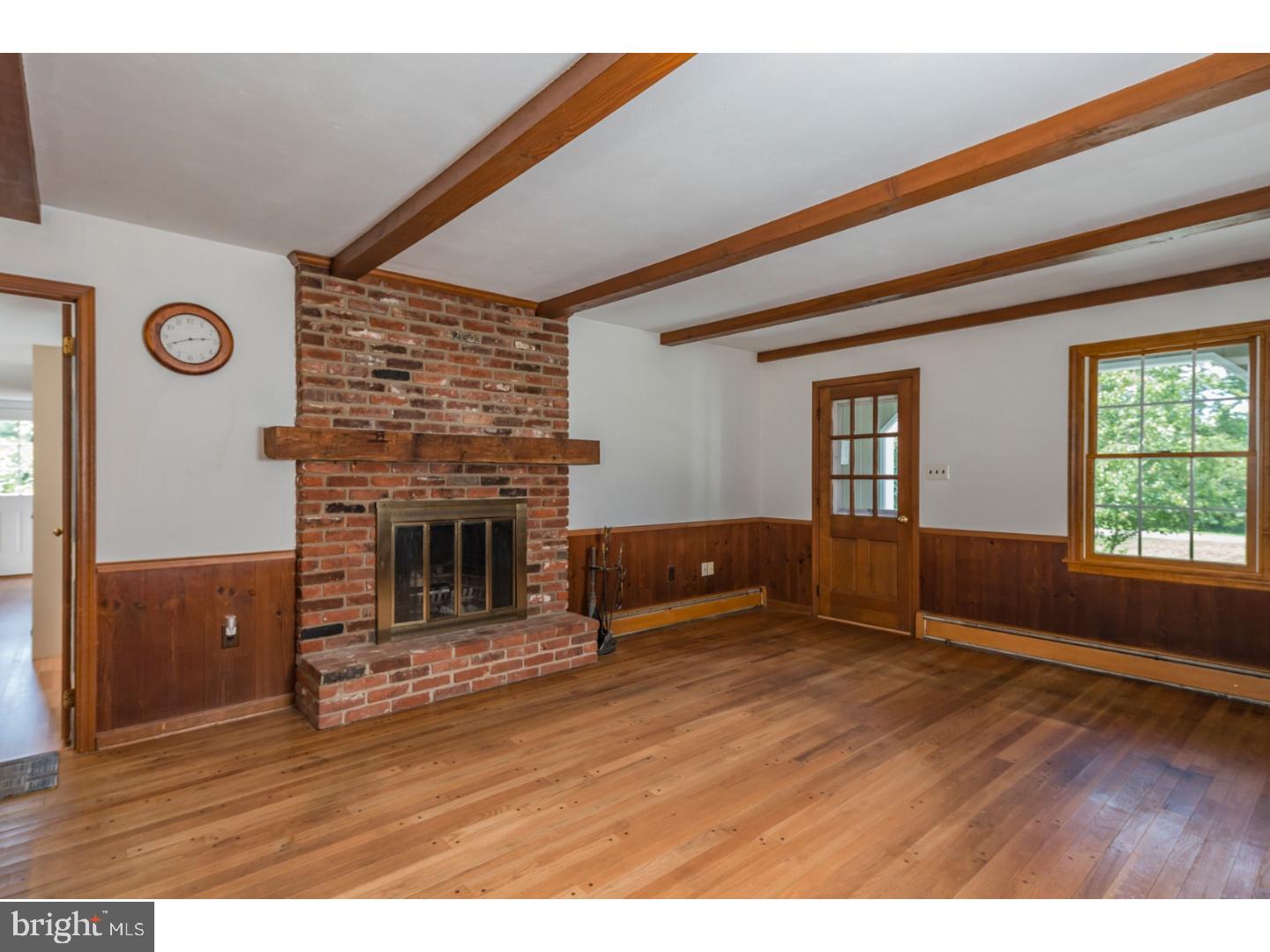469 Federal City Road Pennington, NJ 08534 - Photo 12 of 25 a view of empty room with wooden floor and fireplace
