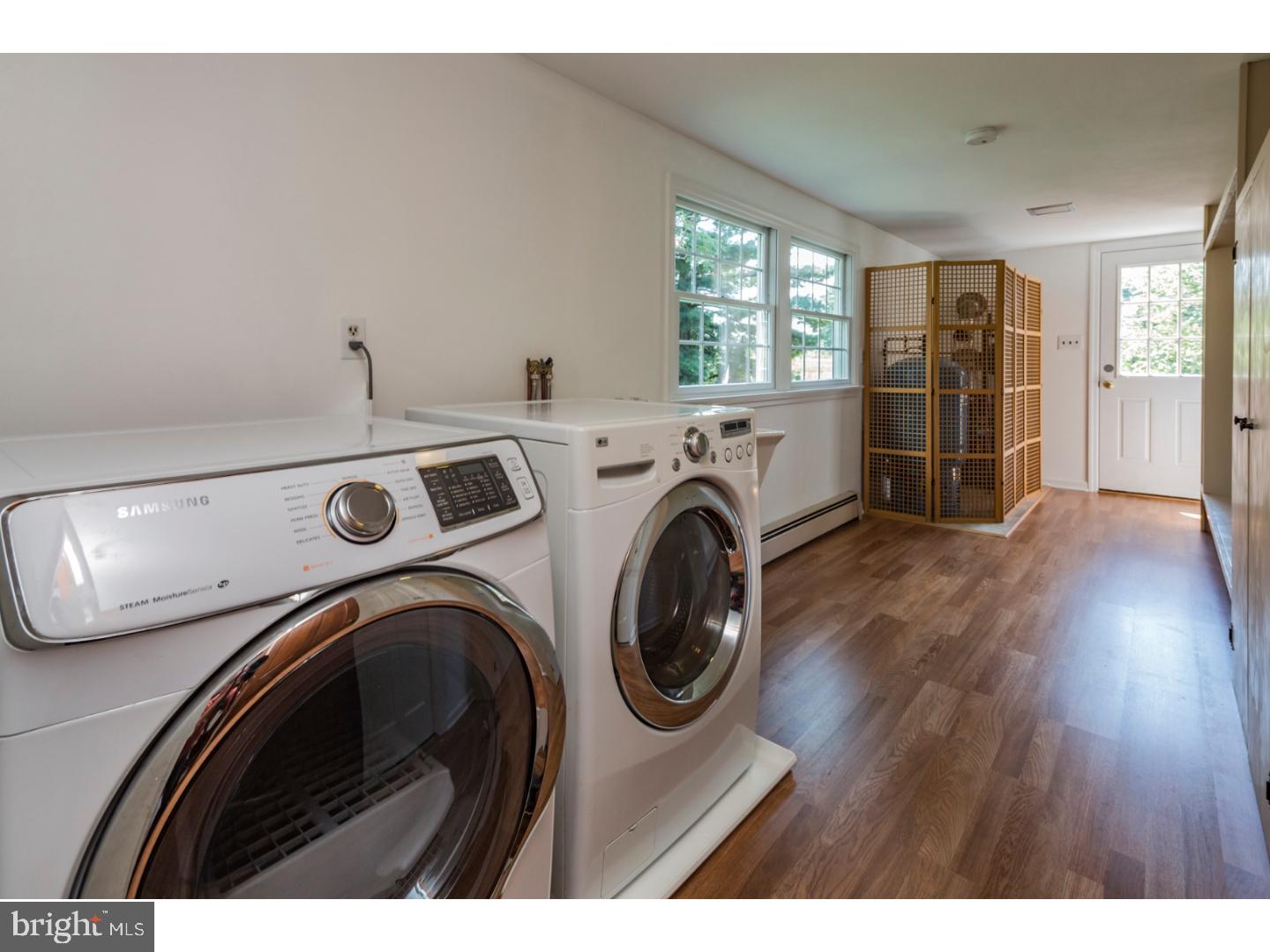 469 Federal City Road Pennington, NJ 08534 - Photo 15 of 25 a view of washer and dryer with bathroom in the background