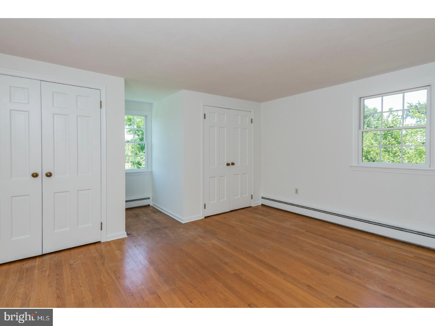 469 Federal City Road Pennington, NJ 08534 - Photo 17 of 25 a view of an empty room with wooden floor and a window