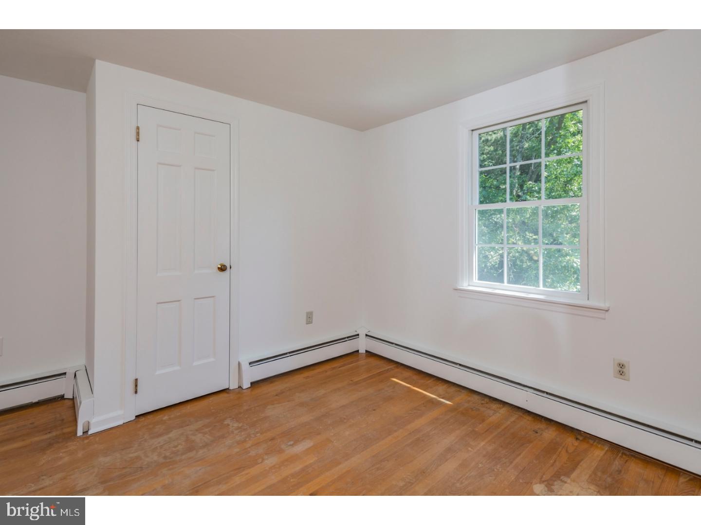 469 Federal City Road Pennington, NJ 08534 - Photo 18 of 25 a view of an empty room with wooden floor and a window