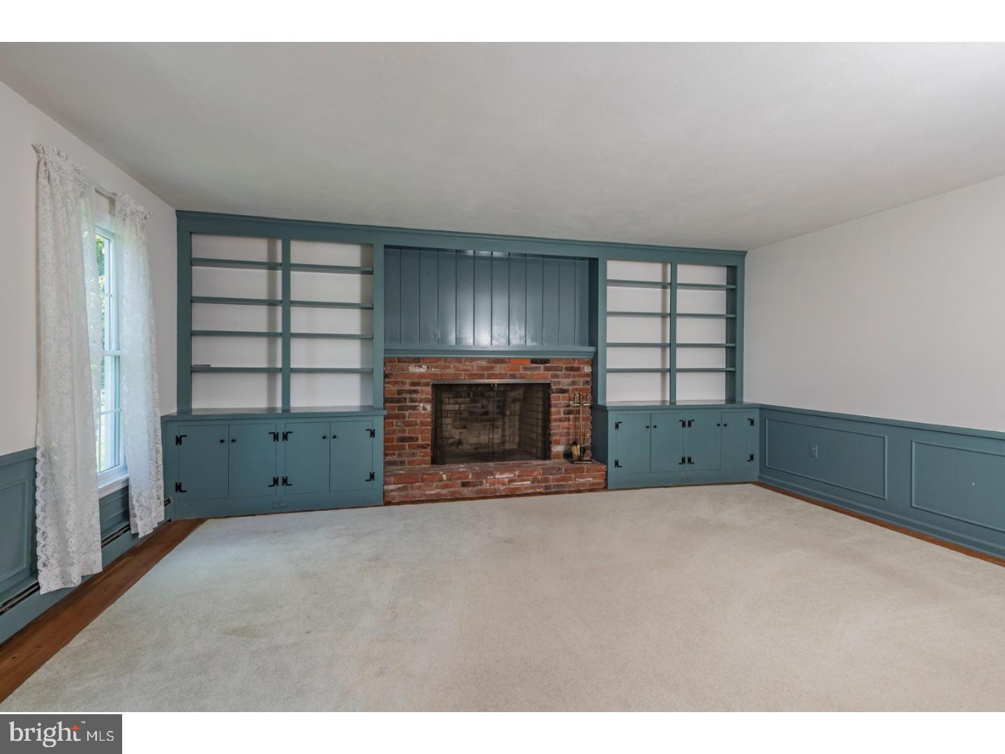 469 Federal City Road Pennington, NJ 08534 - Photo 5 of 25 a view of an empty room with a fireplace and a window