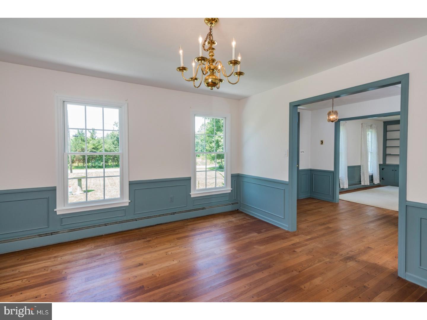 469 Federal City Road Pennington, NJ 08534 - Photo 8 of 25 a view of an empty room with wooden floor and a window