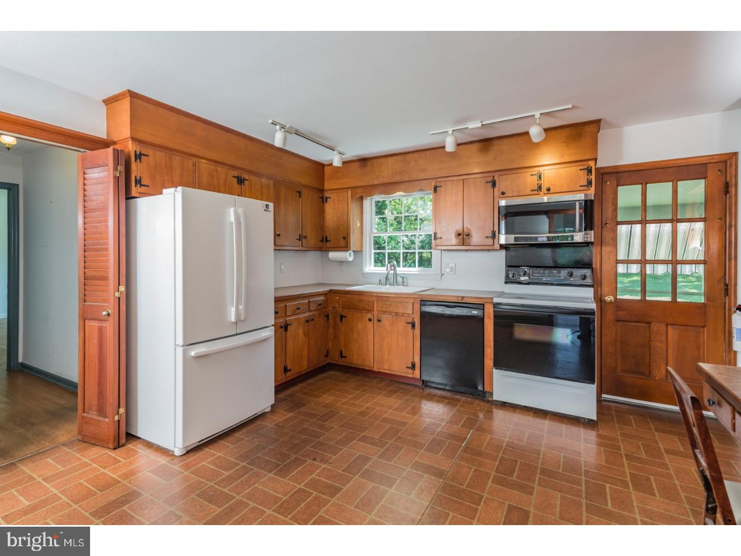 469 Federal City Road Pennington, NJ 08534 - Photo 10 of 25 a kitchen with stainless steel appliances a stove a refrigerator and a sink