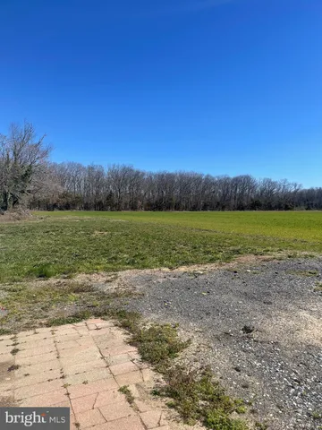 a view of a lake with a yard
