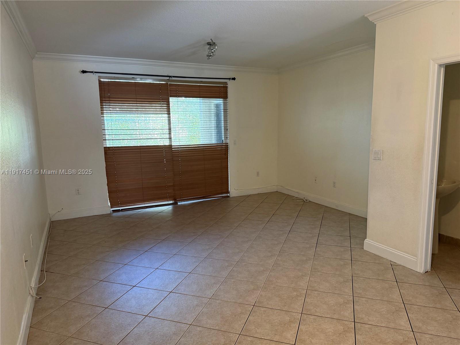 8233 Southwest 25th Court, Unit 104 Miramar, FL 33025 - Photo 3 of 22 an empty room with a empty space