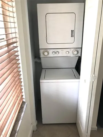 a kitchen with stainless steel appliances granite countertop a stove a refrigerator and a sink