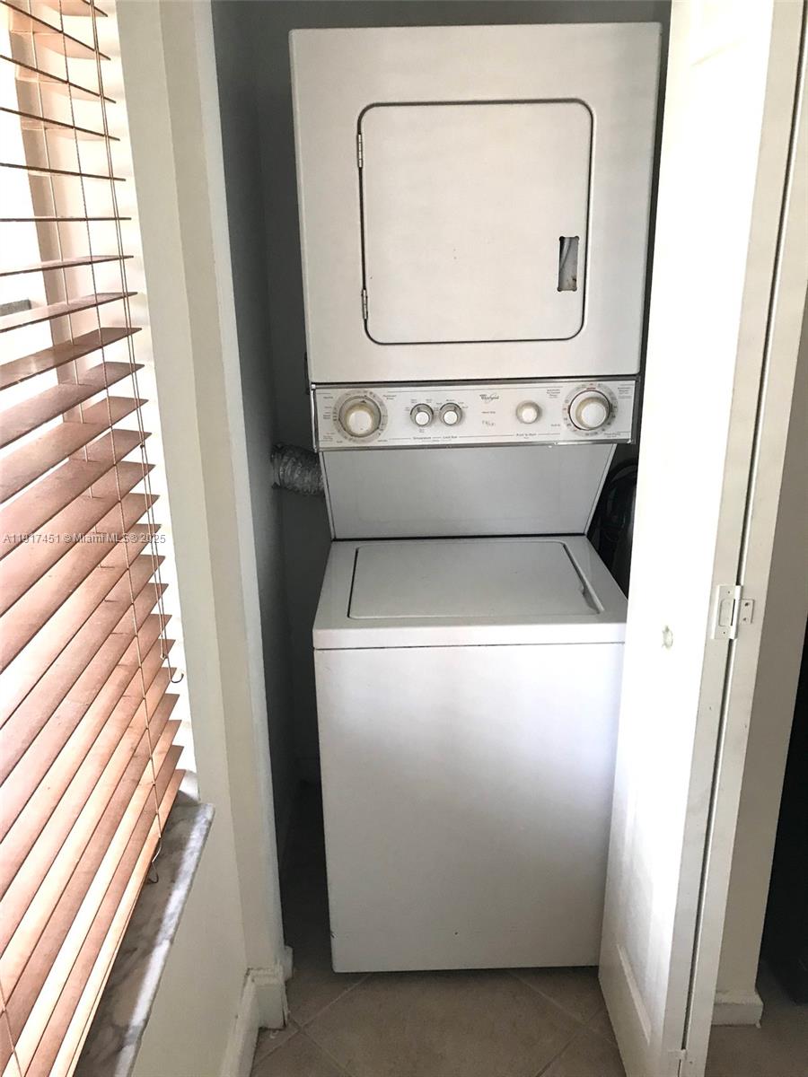 8233 Southwest 25th Court, Unit 104 Miramar, FL 33025 - Photo 7 of 22 a utility room with dryer and washer