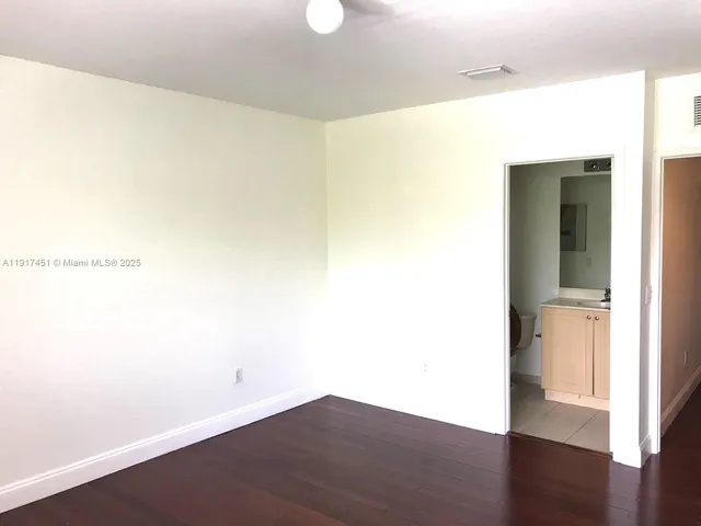 a bathroom with a toilet and a bathtub