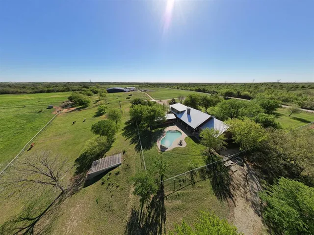 a view of a lake with a yard