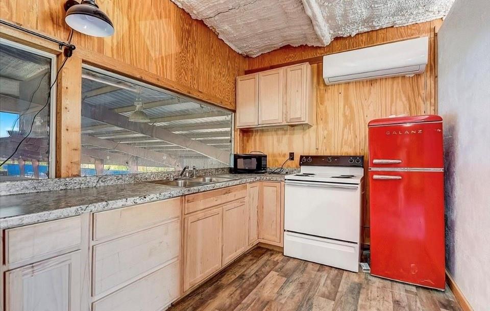 9494 Waide Road Sanger, TX 76266 - Photo 26 of 40 a kitchen with a sink cabinets stainless steel appliances and a window