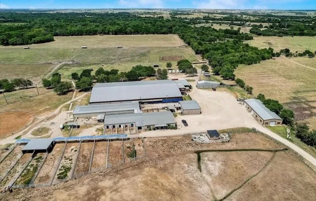 an aerial view of a house with outdoor space