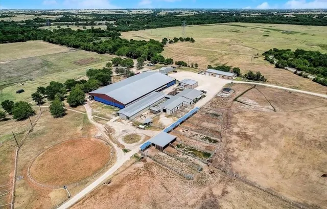 an aerial view of a house with lake view