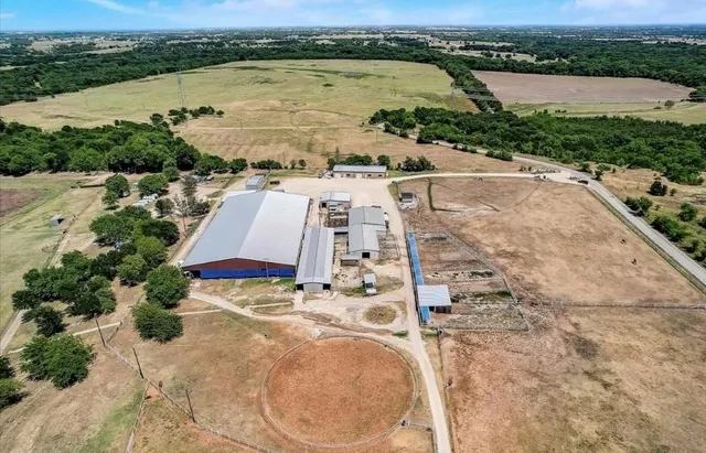 an aerial view of a house with a lake view