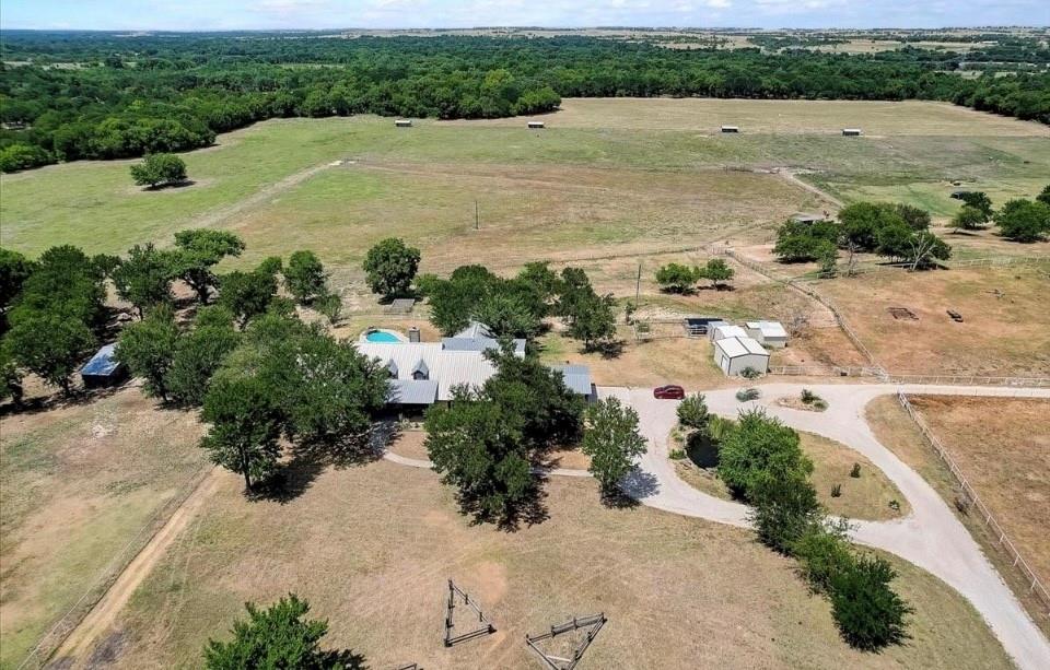 9494 Waide Road Sanger, TX 76266 - Photo 33 of 40 an aerial view of a house with a yard and lake view