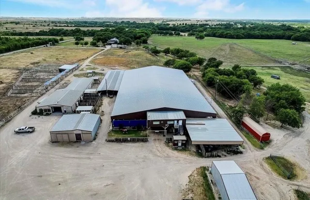 an aerial view of a house with outdoor space