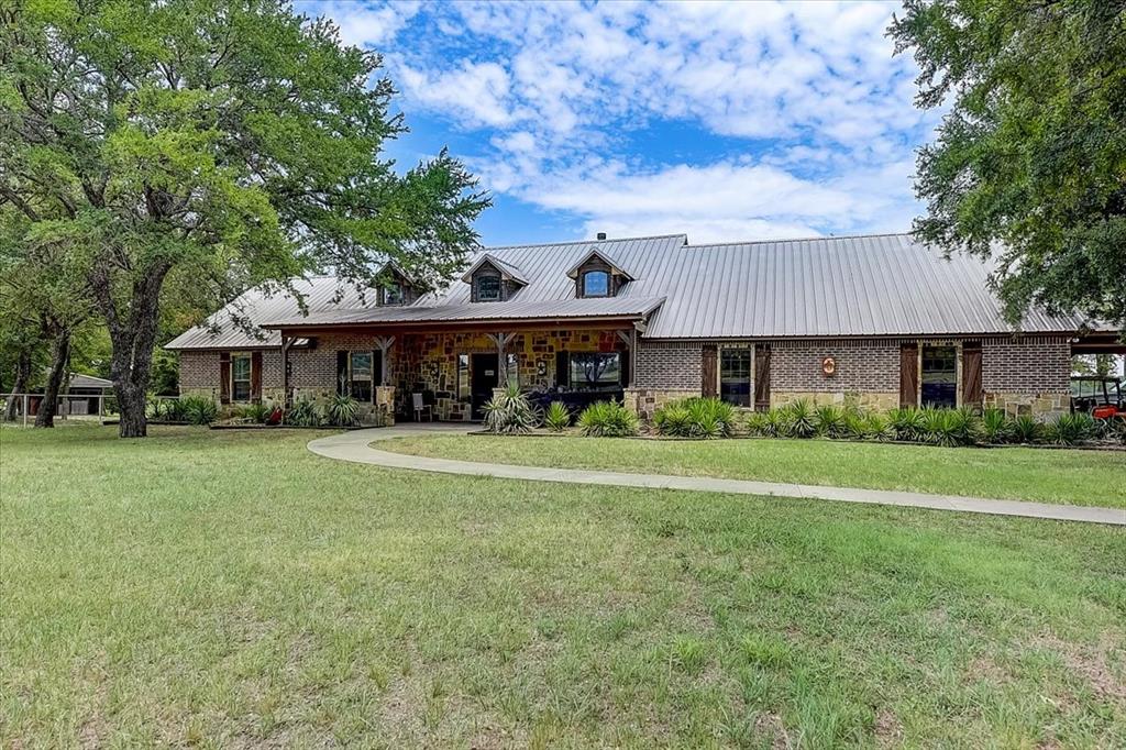 9494 Waide Road Sanger, TX 76266 - Photo 8 of 40 a front view of a house with a garden