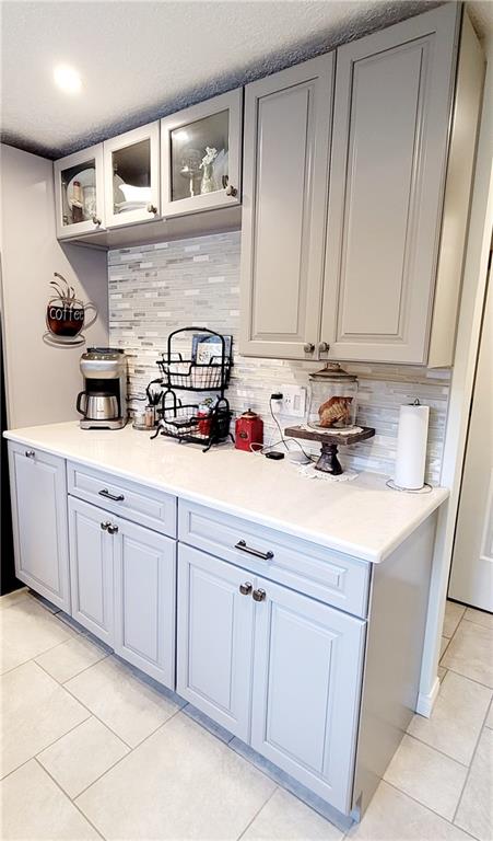 5107 McCandless Road Butler, PA 16001 - Photo 11 of 25 a kitchen with a sink dishwasher stove and cabinets