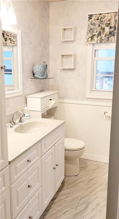 5107 McCandless Road Butler, PA 16001 - Photo 14 of 25 a bathroom with a sink a toilet and a mirror