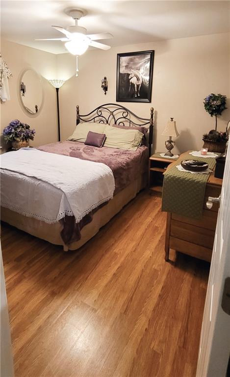 5107 McCandless Road Butler, PA 16001 - Photo 16 of 25 a bedroom with a bed and wooden floor
