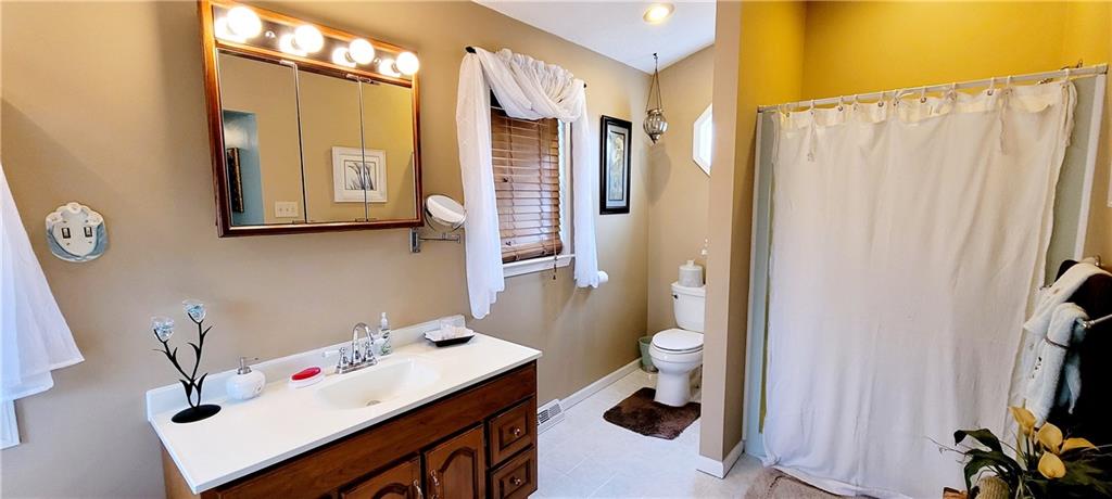 5107 McCandless Road Butler, PA 16001 - Photo 21 of 25 a bathroom with a sink toilet and shower
