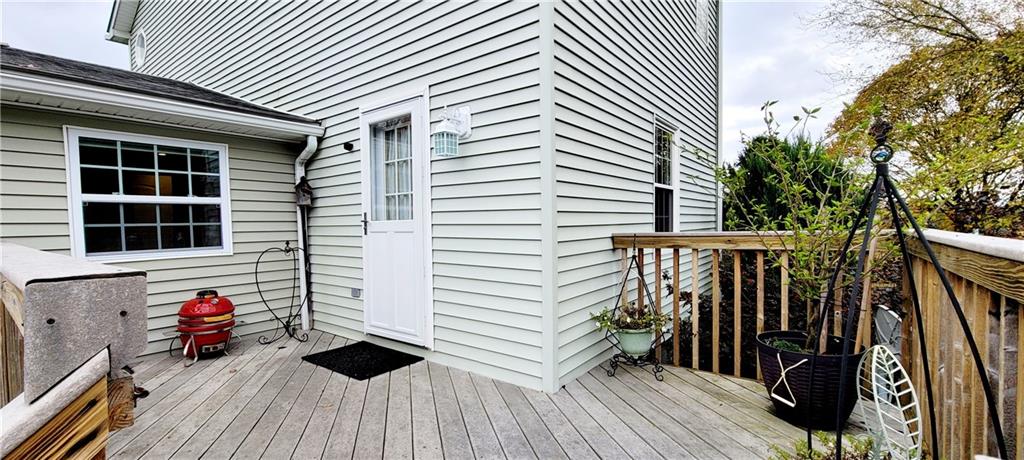 5107 McCandless Road Butler, PA 16001 - Photo 4 of 25 a view of a balcony with chairs and wooden floor