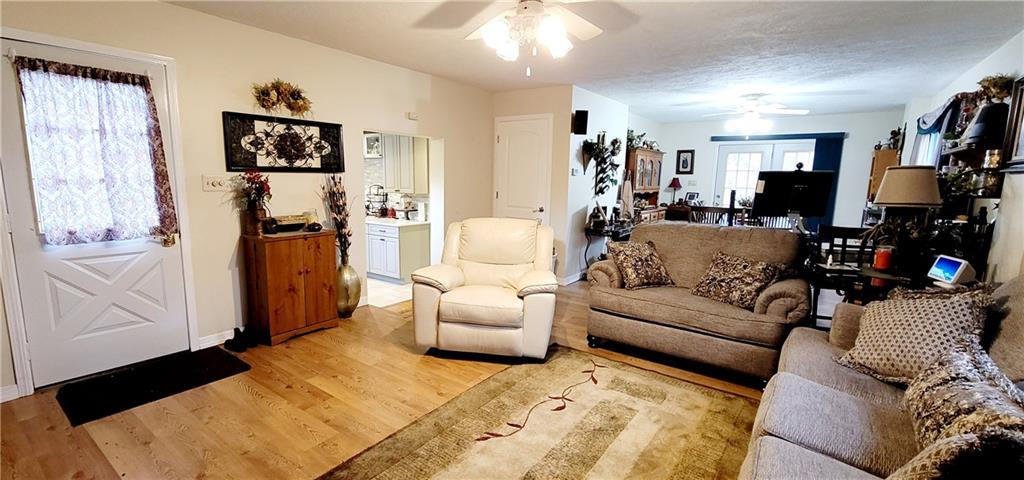 5107 McCandless Road Butler, PA 16001 - Photo 5 of 25 a living room with furniture and a flat screen tv