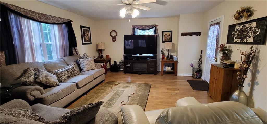5107 McCandless Road Butler, PA 16001 - Photo 6 of 25 a living room with furniture and a flat screen tv