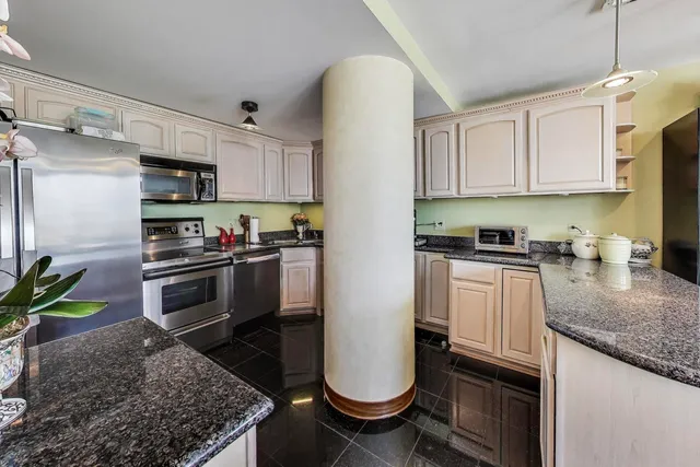 a bedroom with a bed and a dresser in it