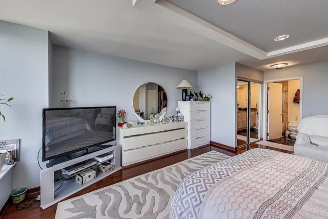 a large room with a bed and a couch