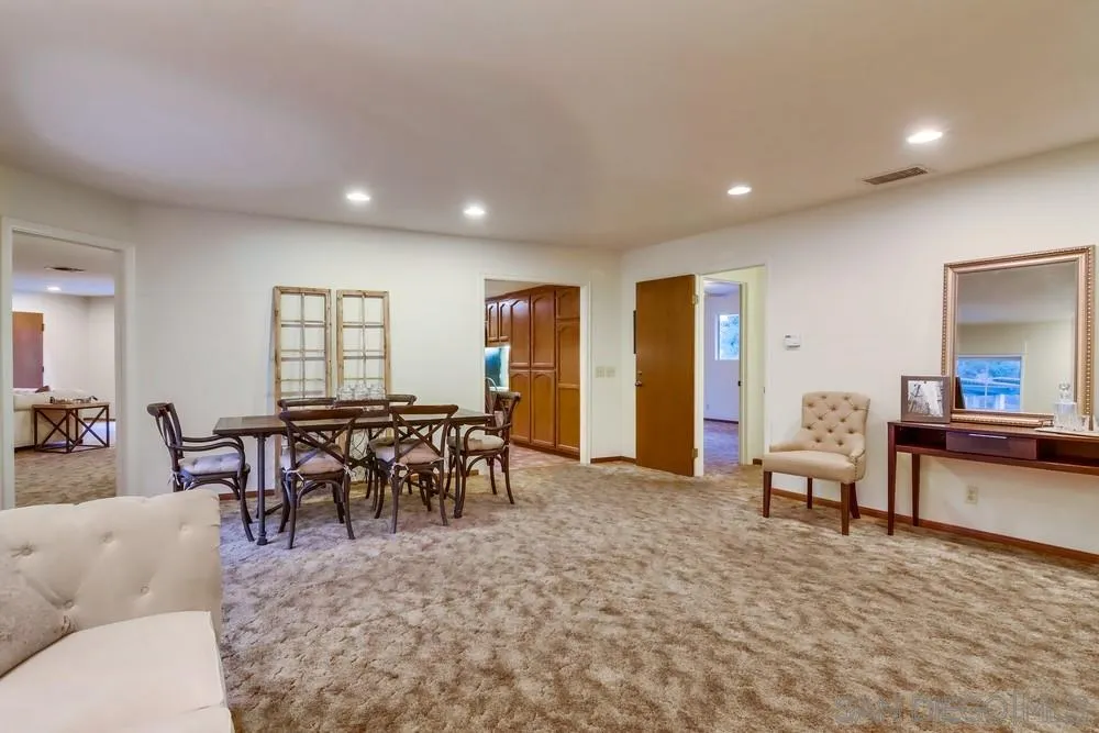 13256 Mapleview Street Lakeside, CA 92040 - Photo 15 of 58 a living room with furniture and a dining table with wooden floor