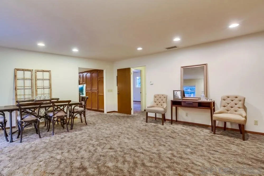 13256 Mapleview Street Lakeside, CA 92040 - Photo 16 of 58 a living room with furniture a dining table and a large window