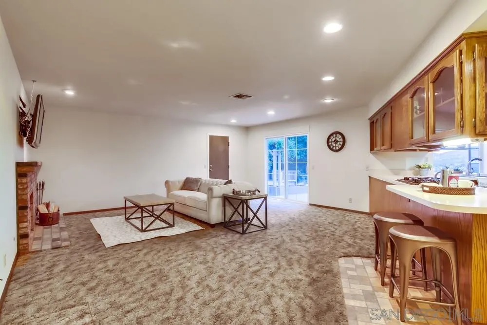 13256 Mapleview Street Lakeside, CA 92040 - Photo 21 of 58 a living room with furniture and a kitchen