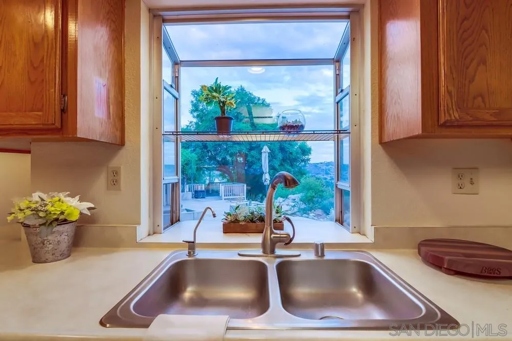 13256 Mapleview Street Lakeside, CA 92040 - Photo 26 of 58 a bathroom with a sink and a window