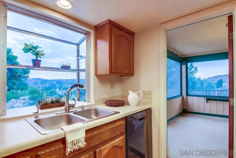 13256 Mapleview Street Lakeside, CA 92040 - Photo 27 of 58 a kitchen with a sink and a large window