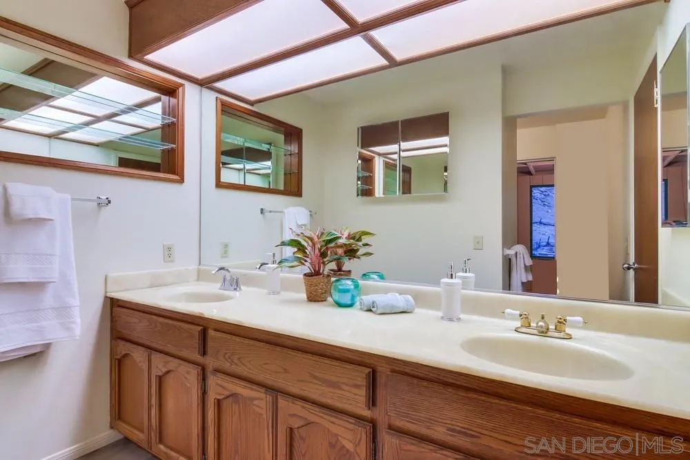 13256 Mapleview Street Lakeside, CA 92040 - Photo 33 of 58 a bathroom with a sink and a mirror