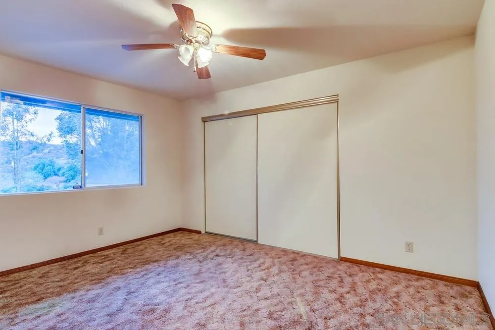 13256 Mapleview Street Lakeside, CA 92040 - Photo 36 of 58 a view of a big room with wooden floor and chandelier fan