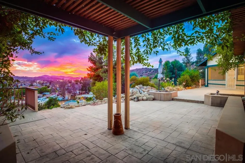 13256 Mapleview Street Lakeside, CA 92040 - Photo 8 of 58 a view of a patio with a table and chairs under an umbrella