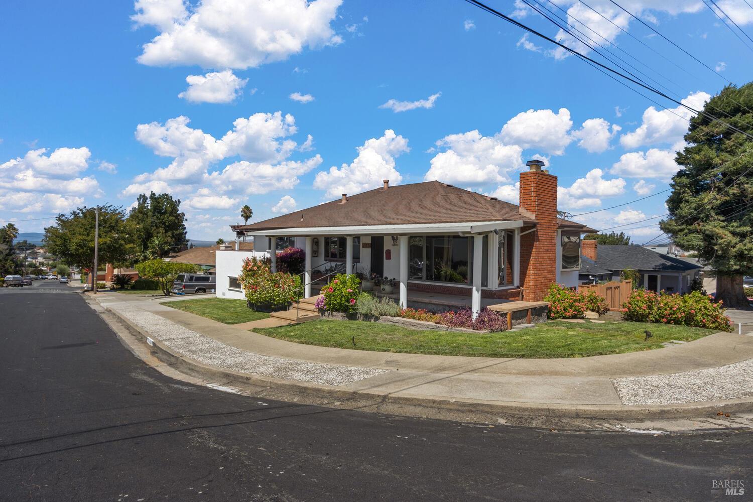 a front view of a house with garden