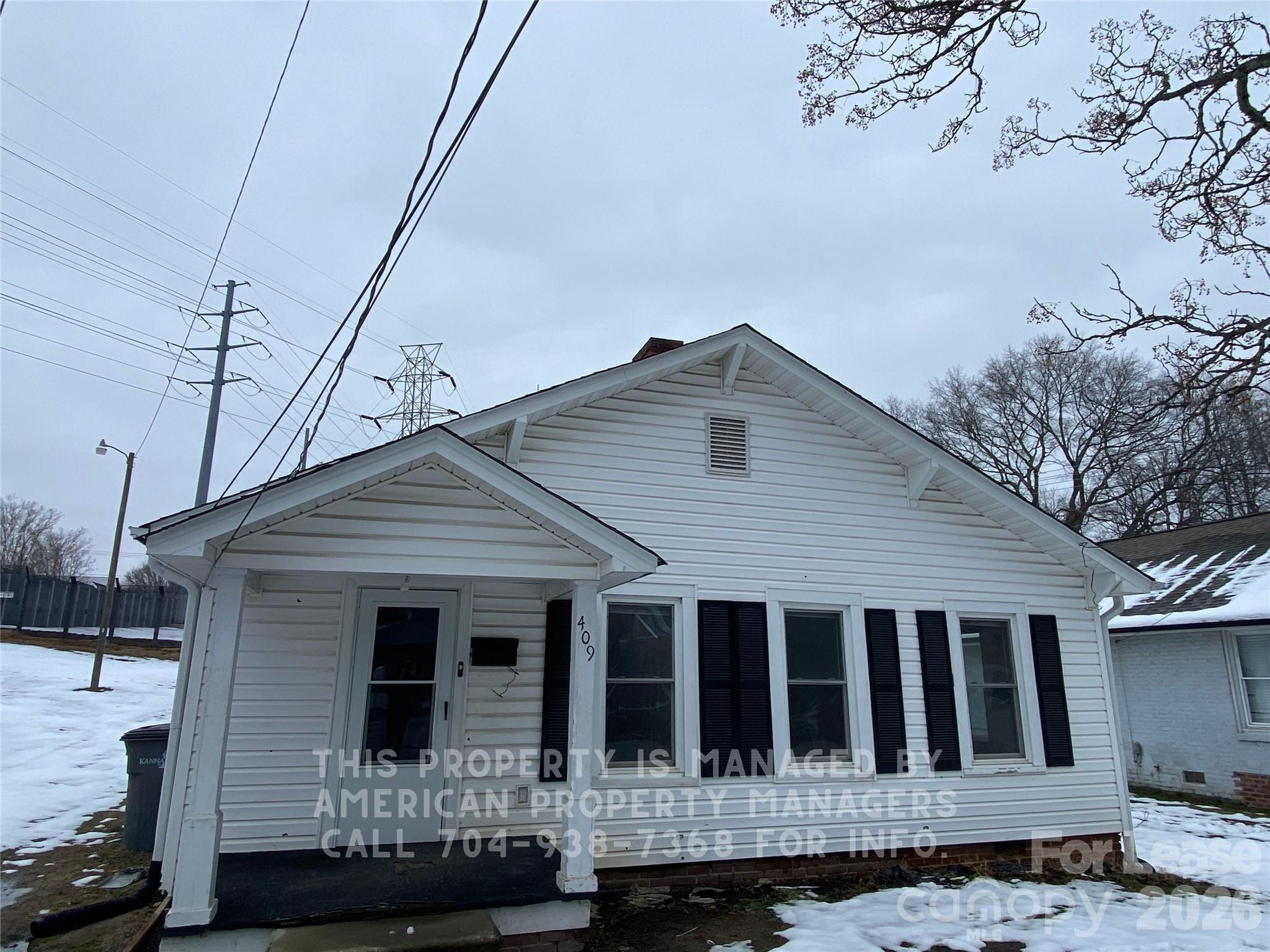 409 East 12th Street Kannapolis, NC 28083 - Photo 1 of 1 a front view of a house with a yard