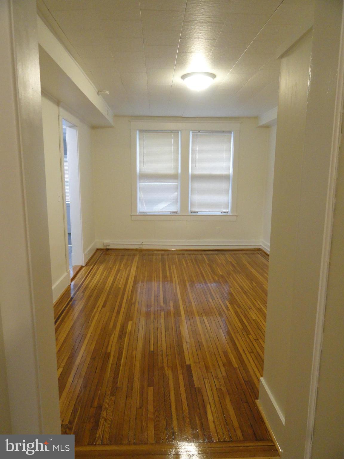 439 Quincy Street Northwest, Unit 1 Washington, DC 20011 - Photo 12 of 19 a view of wooden floor in a room
