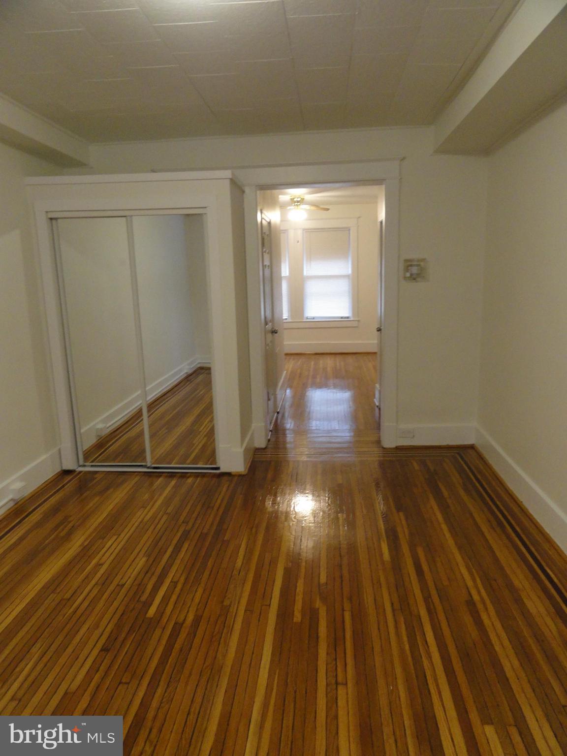 439 Quincy Street Northwest, Unit 1 Washington, DC 20011 - Photo 13 of 19 a view of empty room with wooden floor