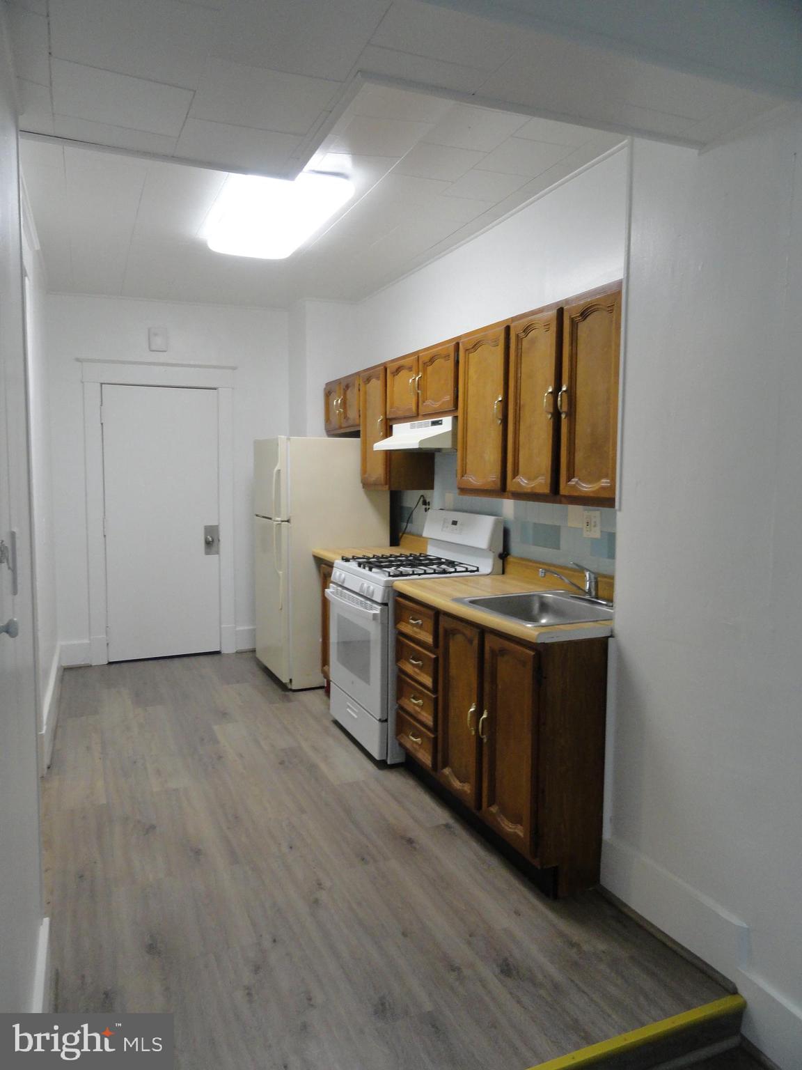439 Quincy Street Northwest, Unit 1 Washington, DC 20011 - Photo 15 of 19 a kitchen with stainless steel appliances a stove a sink and a refrigerator