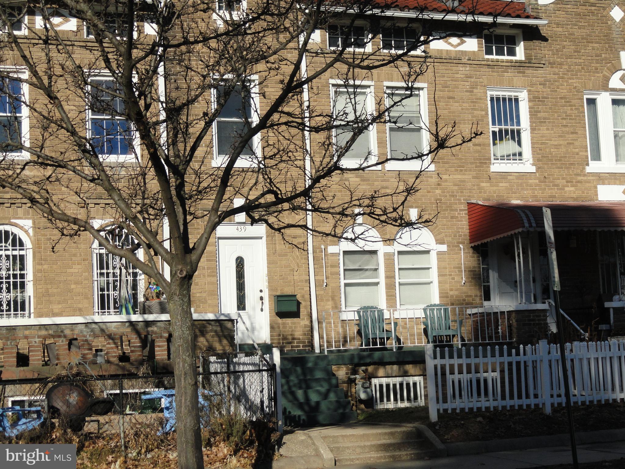 439 Quincy Street Northwest, Unit 1 Washington, DC 20011 - Photo 2 of 19 front view of a house with a tree