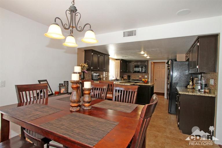 68565 Senora Road Cathedral City, CA 92234 - Photo 15 of 37 a view of a dining room with furniture