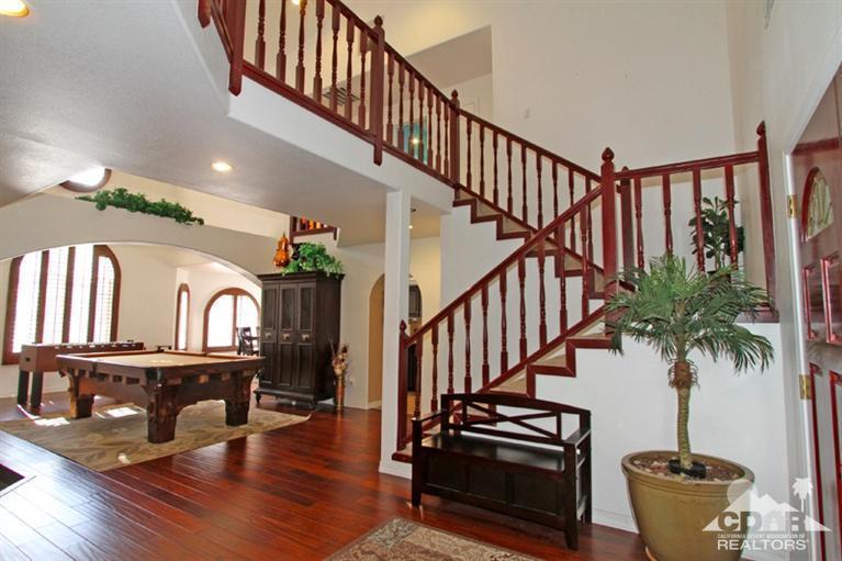 68565 Senora Road Cathedral City, CA 92234 - Photo 2 of 37 a view of staircase with furniture and a potted plant