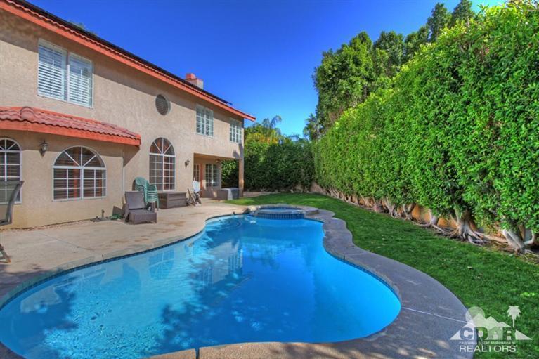 68565 Senora Road Cathedral City, CA 92234 - Photo 29 of 37 a view of a house with pool and chairs